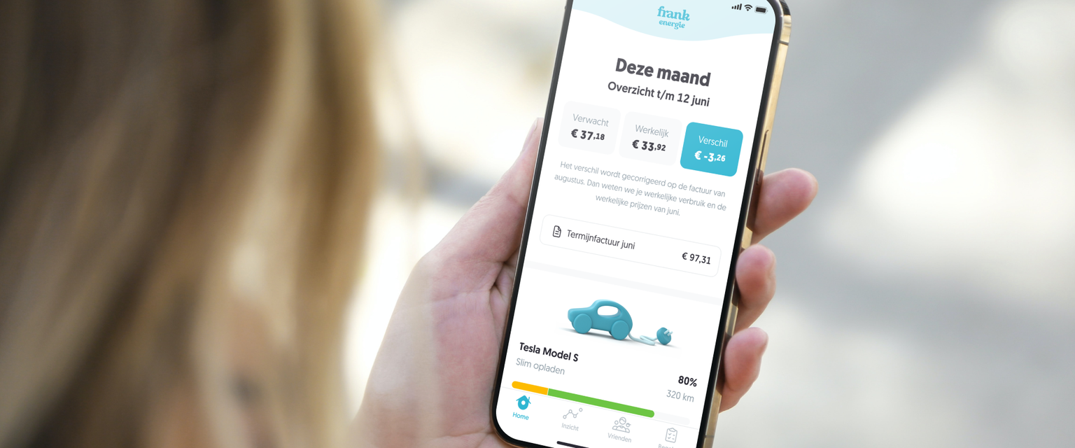 Woman holding a phone with an app opened